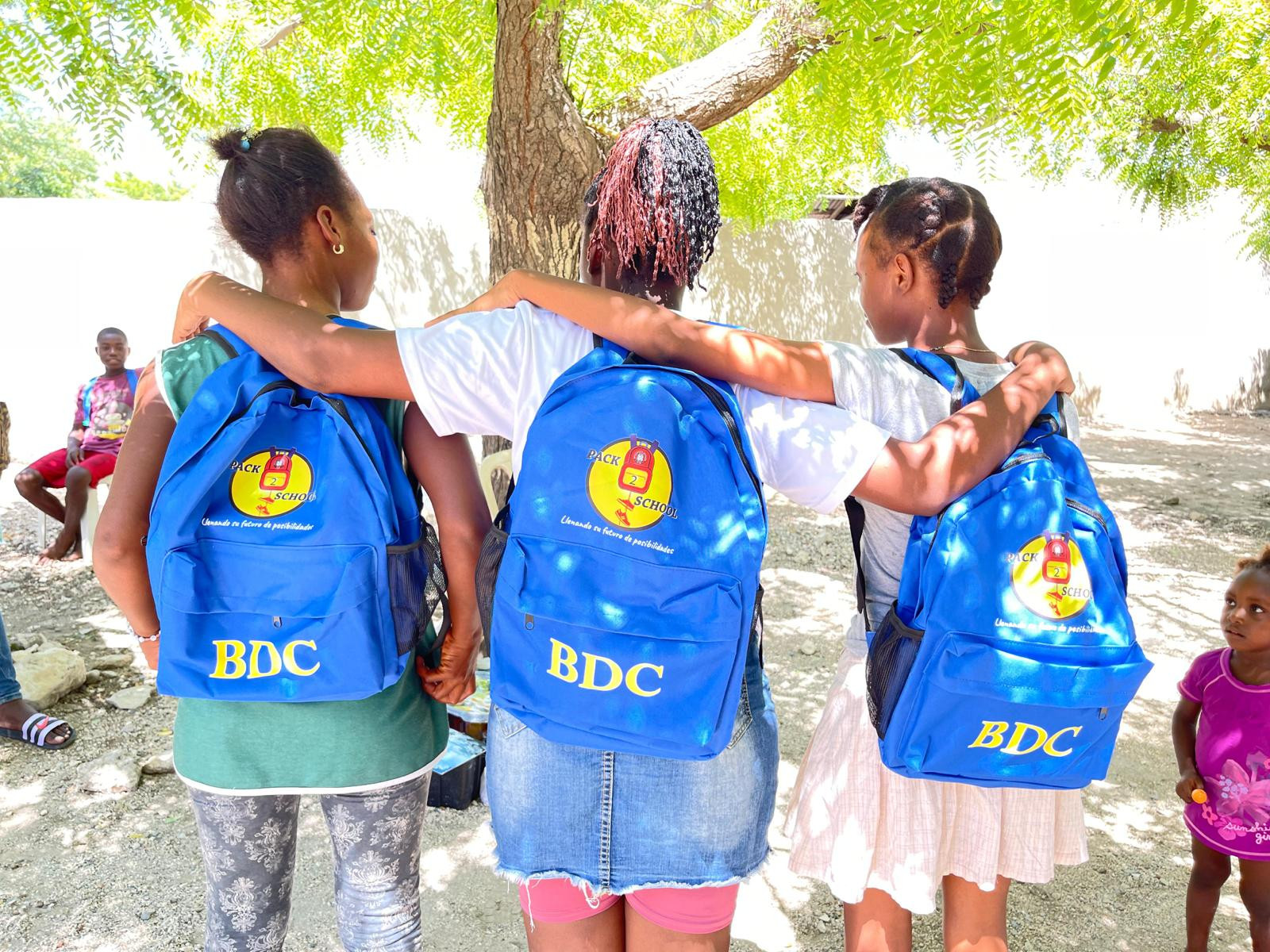 Students and volunteers at a Pack 2 School supply distribution