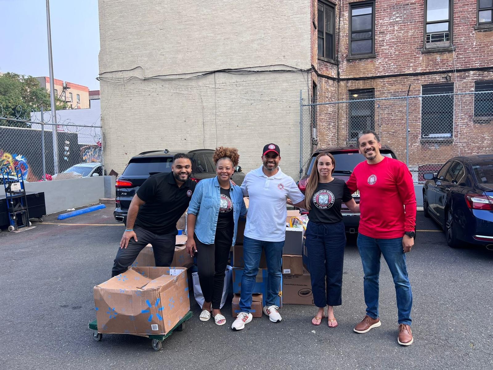 Pack 2 School volunteers with donated school supply boxes